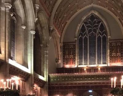 an interior of a church showing arched windows and richly decorated walls