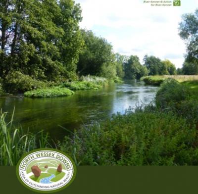An outdoor scene.  A river flows through a rural landscape, flanked by trees and plants.  A logo reads North Wessex Downs AONB. The photo credit is ARK, Action for the river kennet.  Click or tap the 