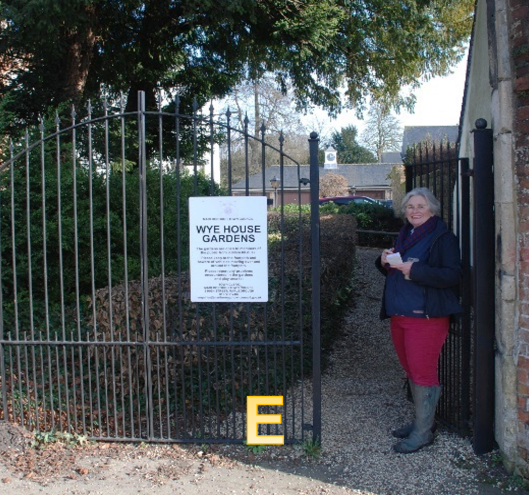 a woman stands in a gateway
